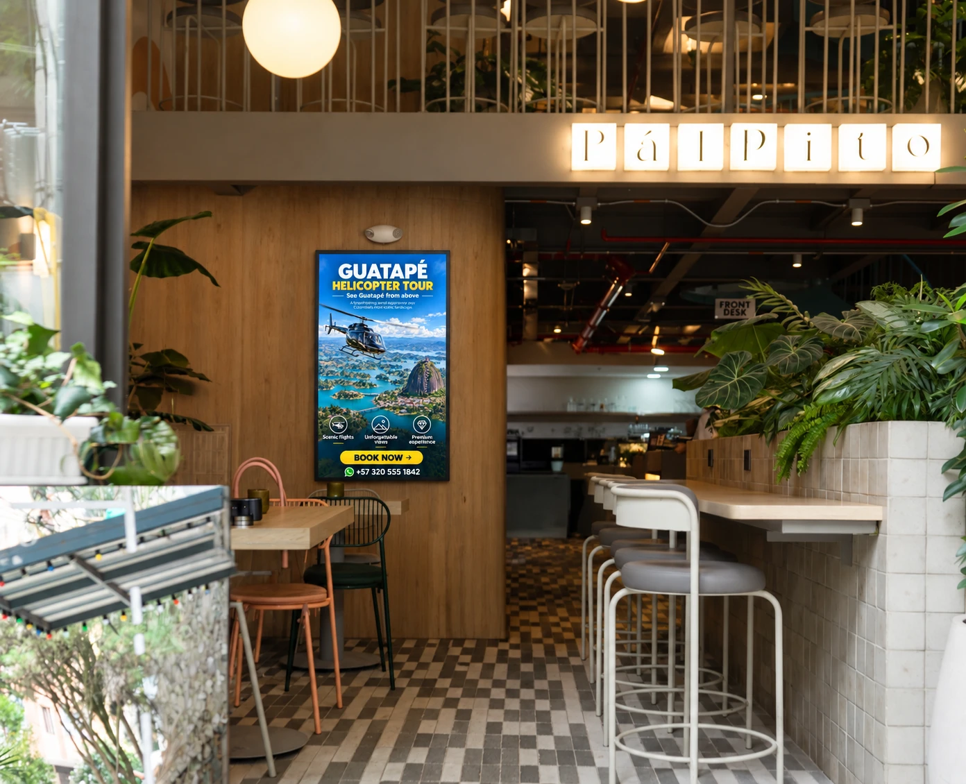 Pantalla publicitaria junto al restaurante Pálpito en el lobby de Once 22, Sabaneta